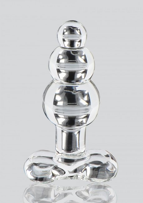 Transparant analplugg tillverkad av högkvalitativ och temperaturkänsligt glas. Den har en smal nacke och bred bas.